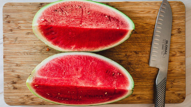 two watermelon quarters and knife