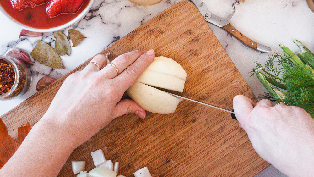 cutting onion into strips