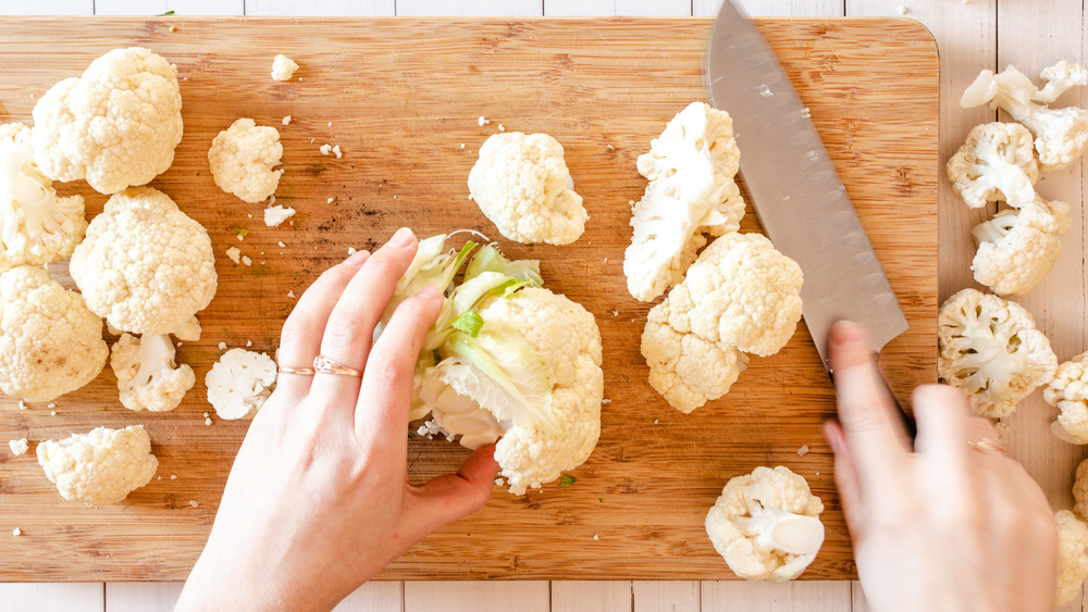 cutting cauliflower into quarters