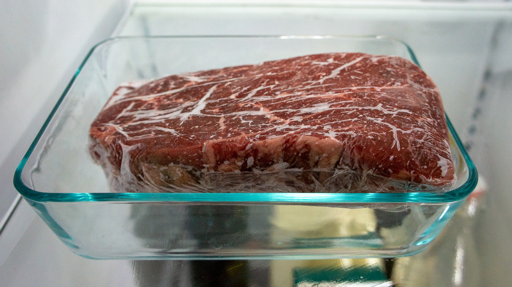 a steak in a bowl in the fridge