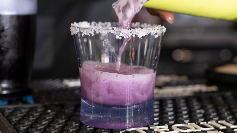 Pouring purple margarita