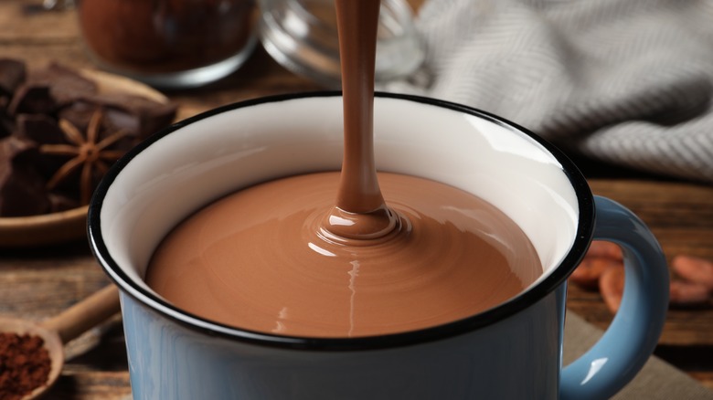 Hot chocolate poured in mug