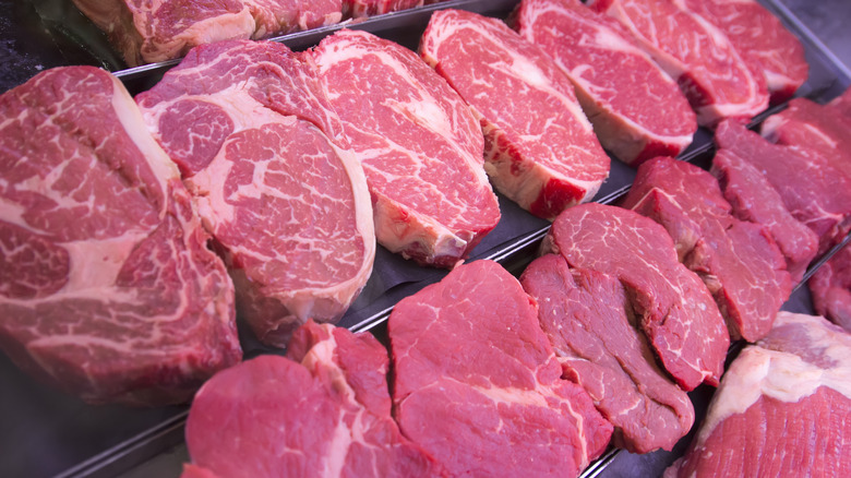 rows of steaks at the grocery store