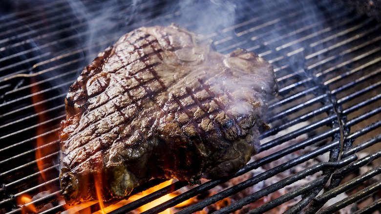 T-bone steak on grill