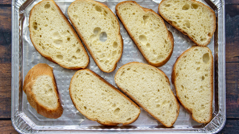 bread slices on baking sheet