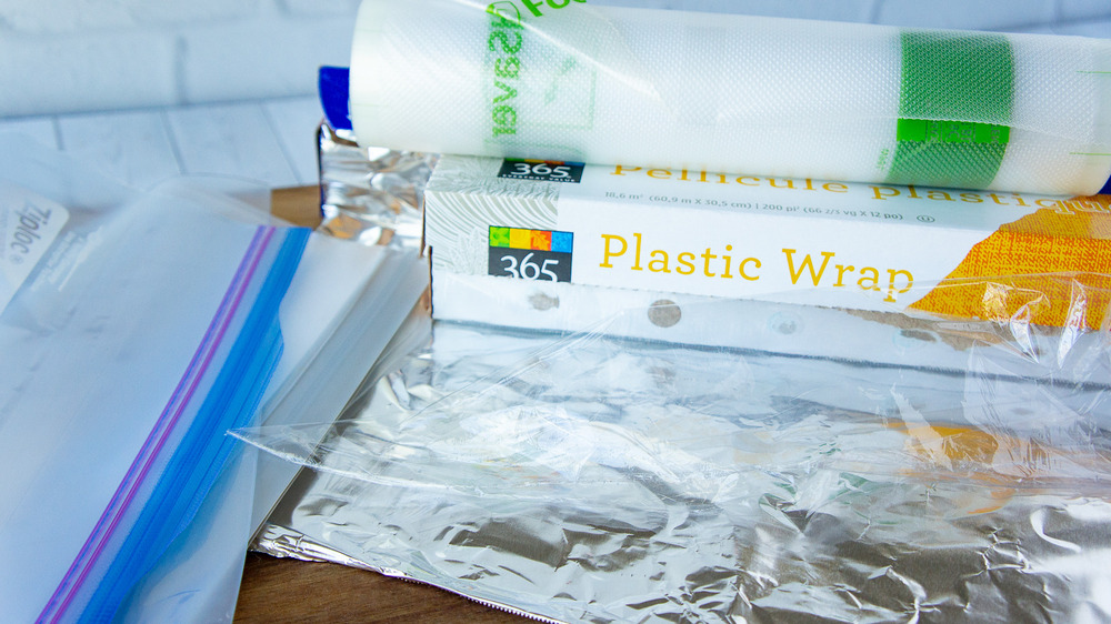 a box of plastic wrap and foil with zip top bags next to it