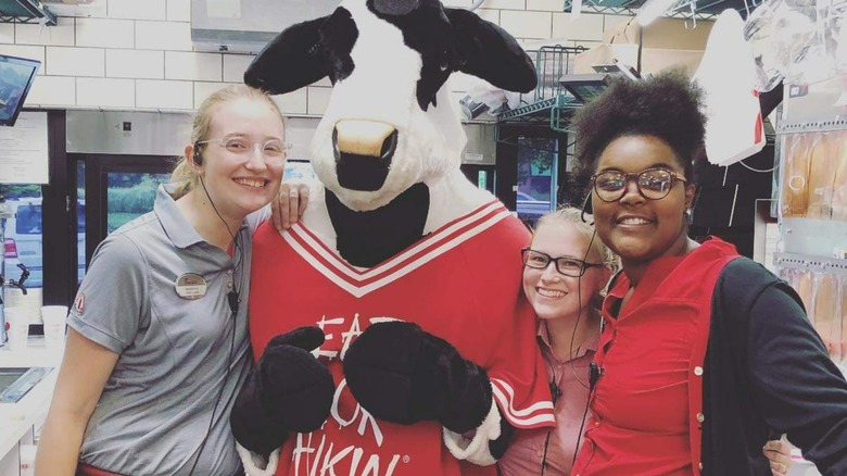 Chick-fil-A employees and a cow