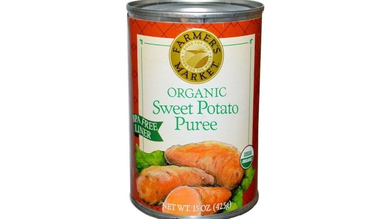 Sweet potato puree in can on white