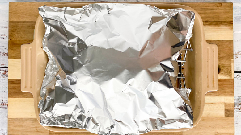 foil-wrapped object in pan