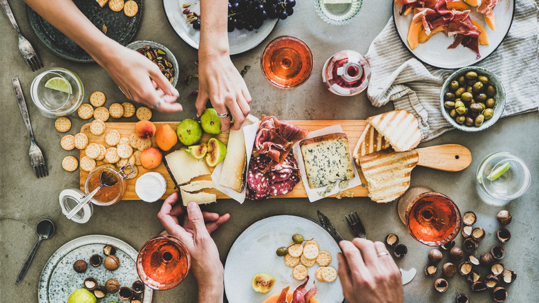 guests enjoying charcuterie board