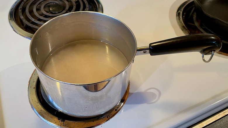 Pot of rice cooking on stove