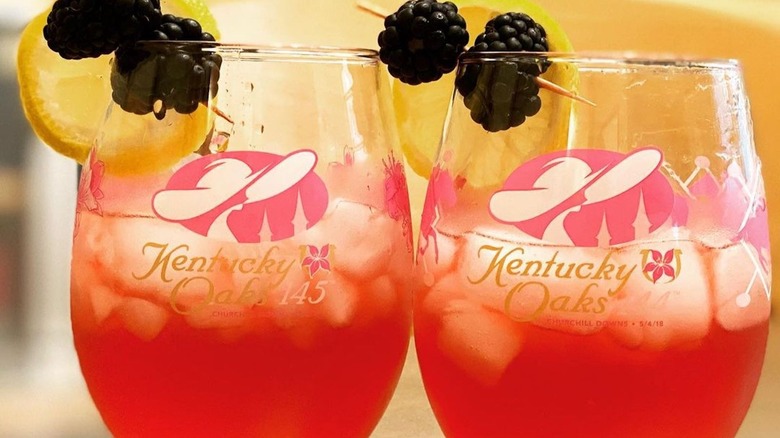 Two Oaks Lily cocktails with fruit garnish