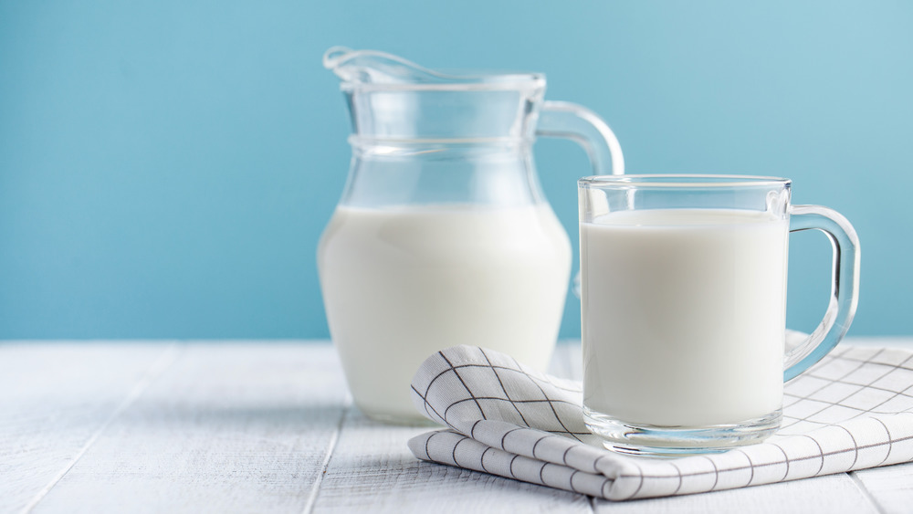 Milk in a pitcher and a cup