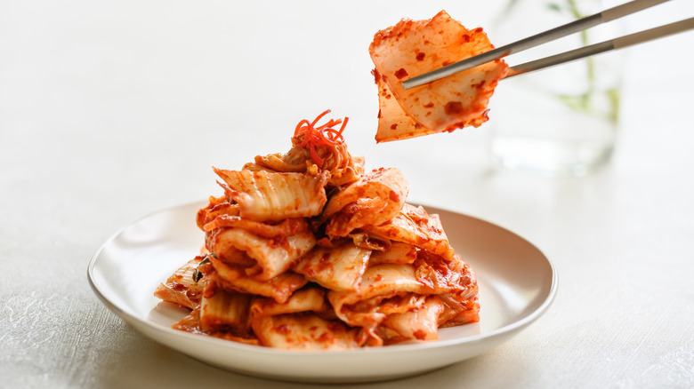 Plate of kimchi with chopsticks