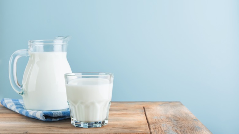 Dairy in bottles blue background