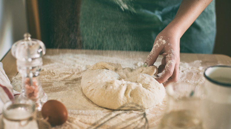 Woman handling biscuit dough