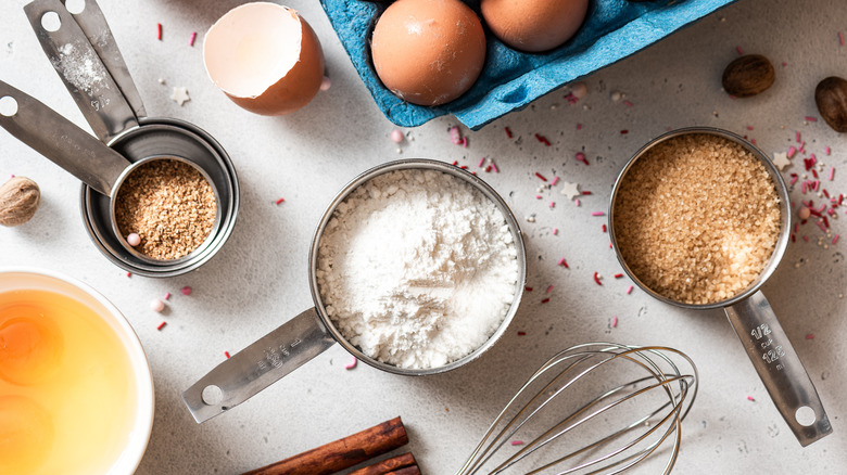 Eggs, flour, and butter on table