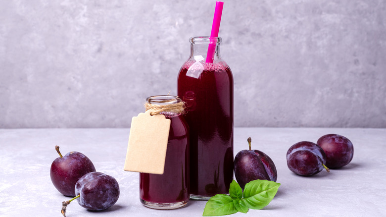 Prune juice in glass bottles