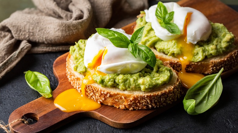 Avocado toast with egg and basil