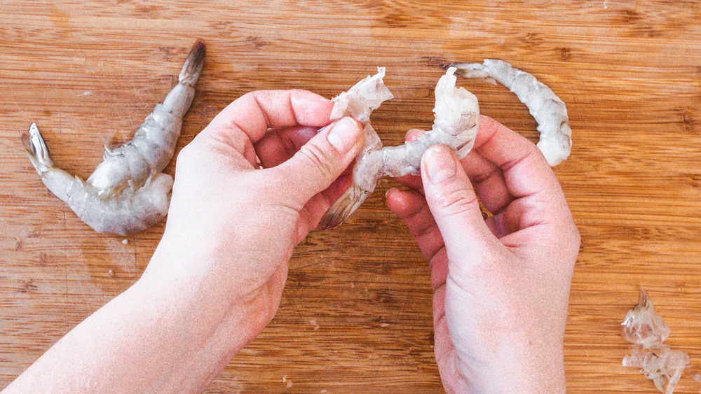 pulling off shrimp peel