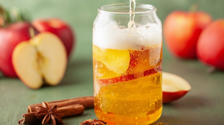 pouring glass of hard cider