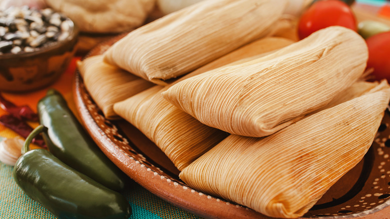 Tamales on brown patterned plate