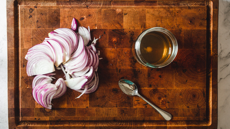 onions and vinegar on cutting board