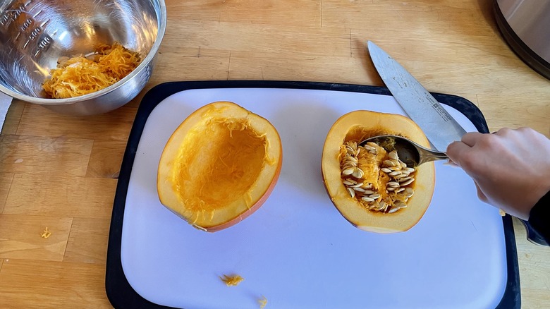 pumpkin seeds being scooped out