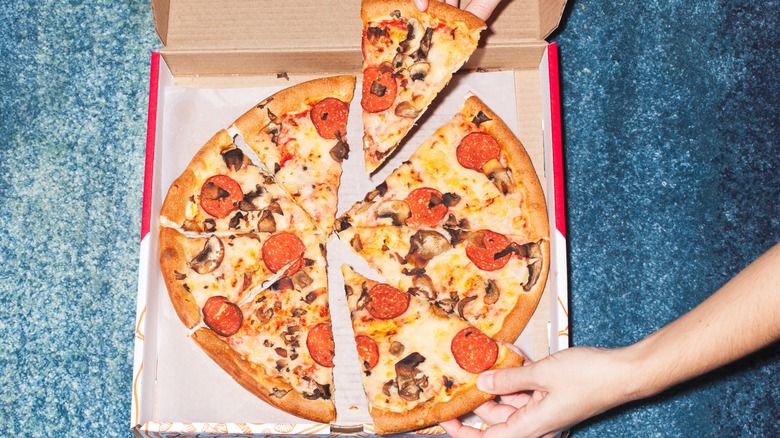 pizza on blue carpet