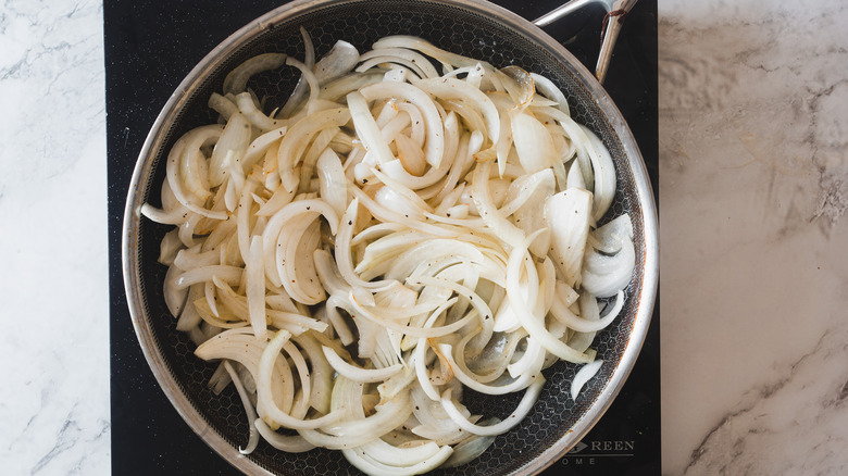 raw onions in pan