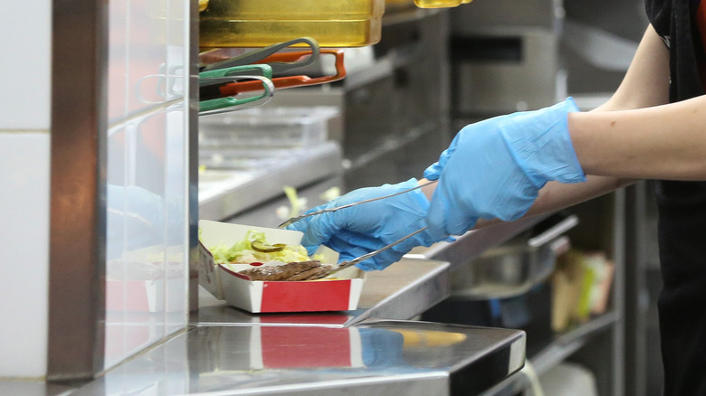 McDonald's employee making burger