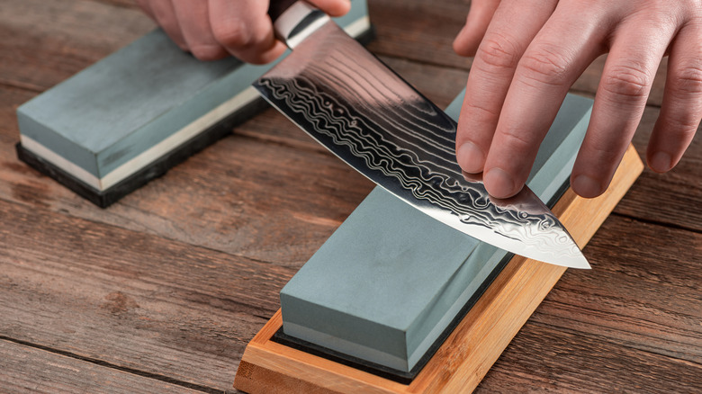 knife sharpened by whetstone 