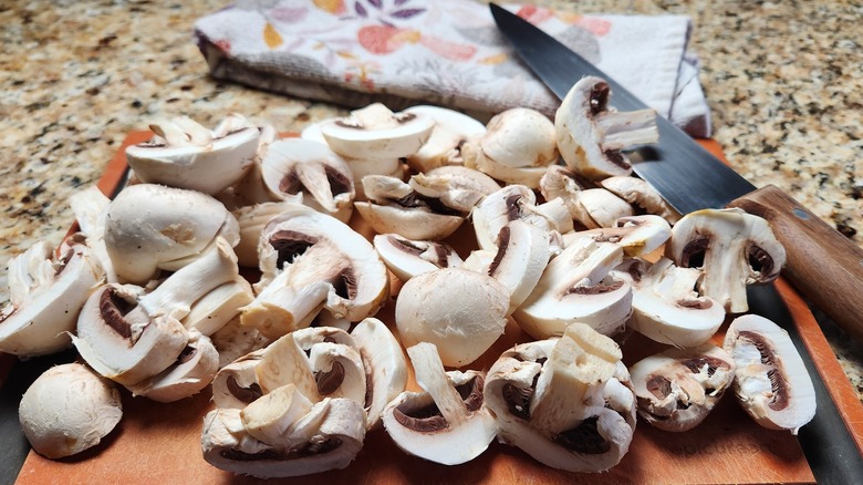 sliced mushrooms and knife