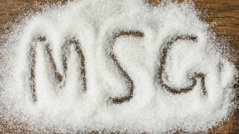 The letters "MSG" spelled out in a pile of MSG powder