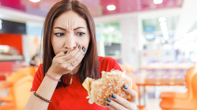 Girl eating a bad meal