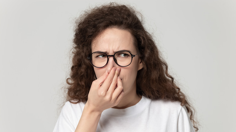 Girl Pinching Her Nose 