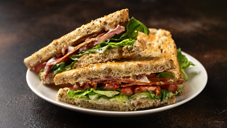 BLT sandwich sitting on plate