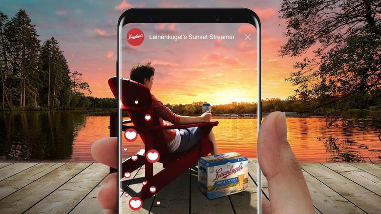 Smart phone taking a photo of the last sunset enjoying Leinenkugel beer