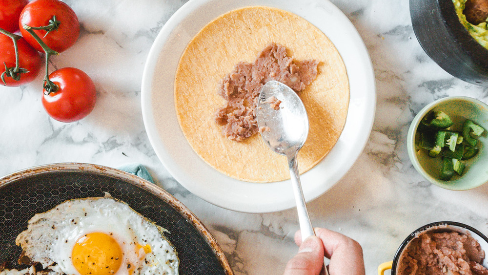 refried beans on tortilla 