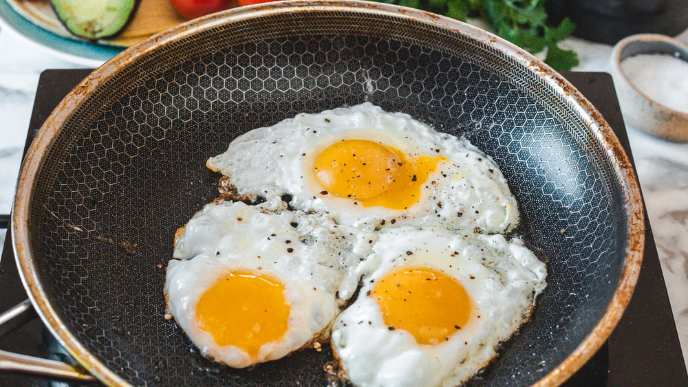 Sunny-side-up eggs in pan