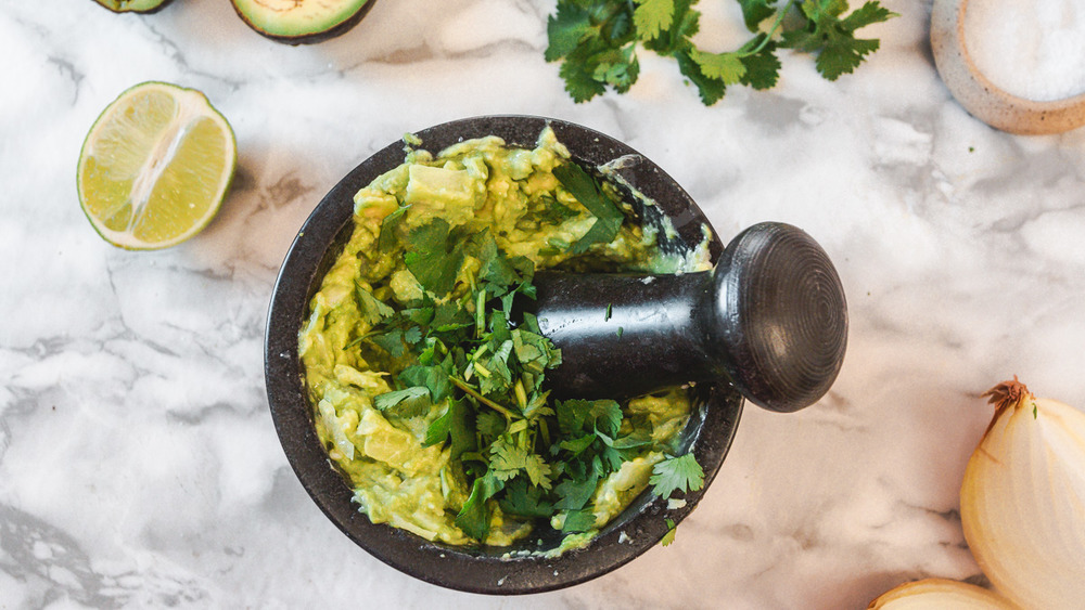 mashing guacamole process 