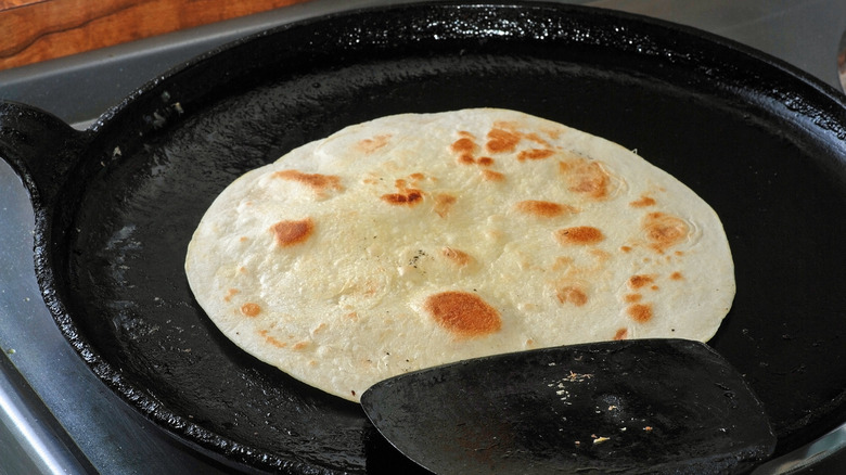 Heating up tortilla on skillet