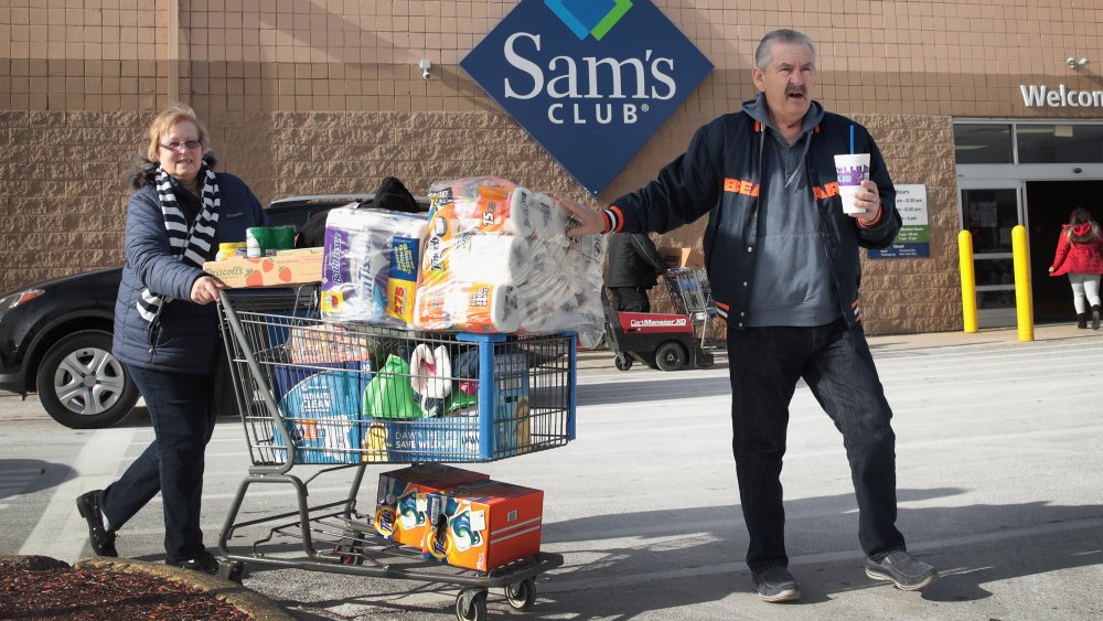 Shoppers with full cart outside Sam's Club