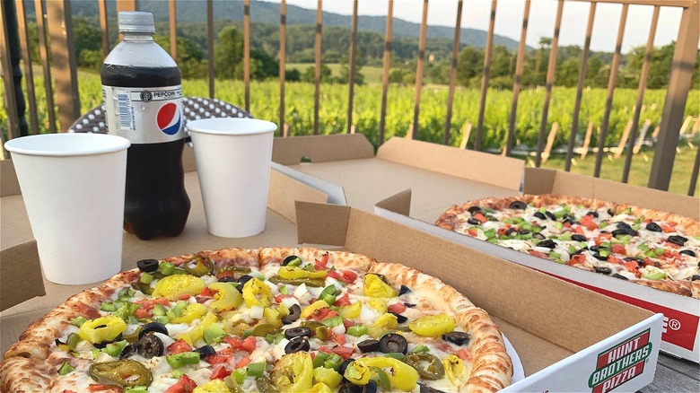 Pizza boxes on wooden deck