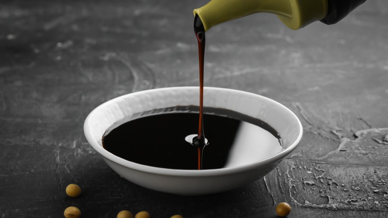 Soy sauce poured into dish