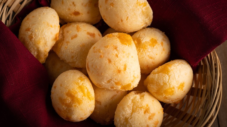 Brazilian cheese breads in basket with napkin