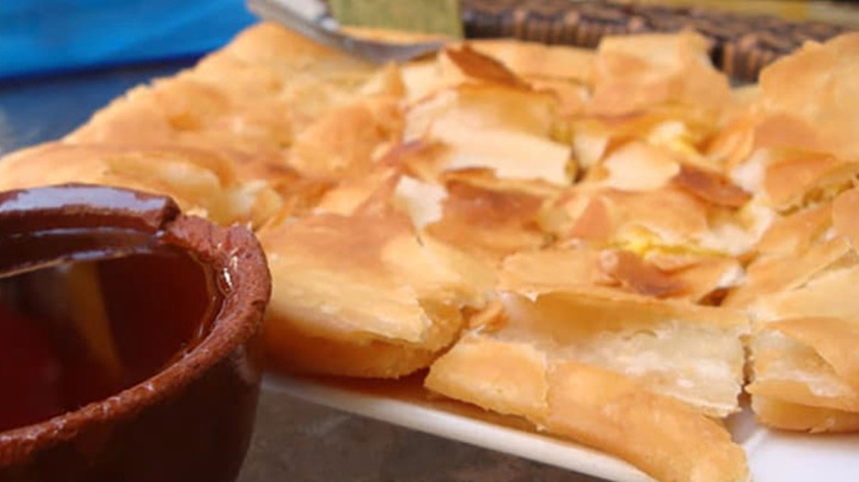 fatira pastry with bowl of honey