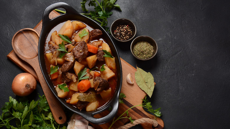 Irish stew on wooden cutting board