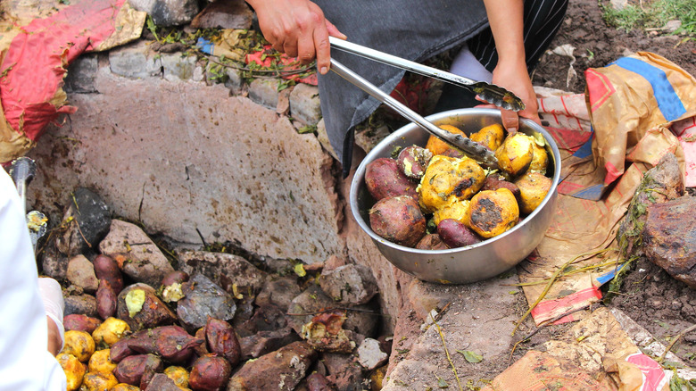 Pit roasted potatoes and meat