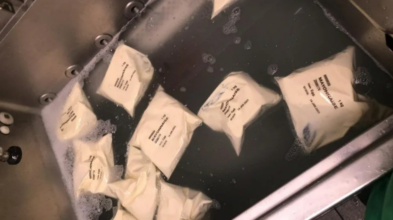 Bags of mayo in a sink